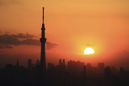 silhouette of tower during sunset thumbnail
