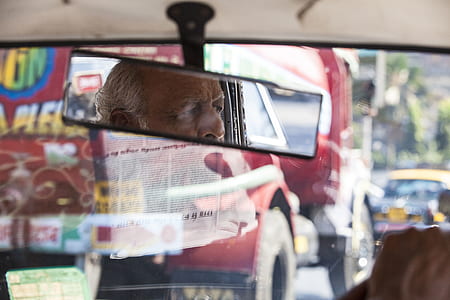 man in vehicle rear view mirror thumbnail