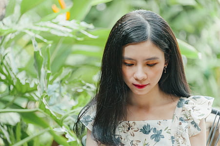 Close-Up Photo of Woman Near Leaves thumbnail