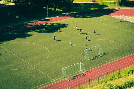 aerial photography of people playing soccer at daytime thumbnail