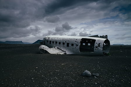 crashed plane on desert during daytime thumbnail