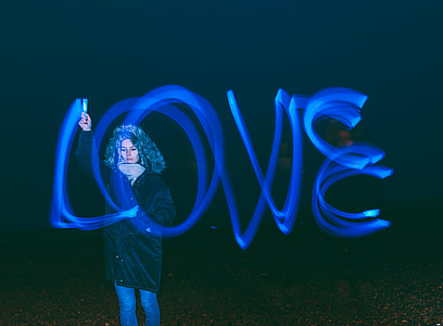 woman light writing time lapse photography thumbnail