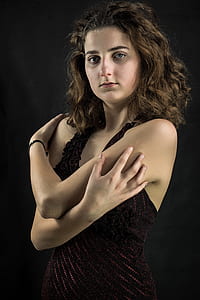 woman wearing black shirt touching her arms thumbnail