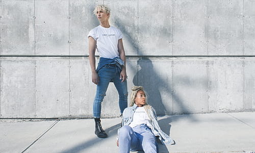 man and woman wearing white t-shirts at daytime thumbnail