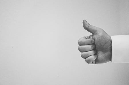 person doing thumbs up hand gesture thumbnail