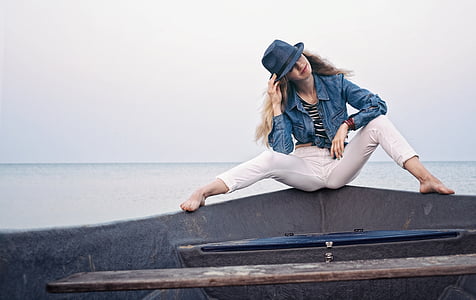 woman sits on black platform thumbnail