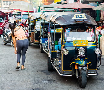 black auto rickshaws in line thumbnail