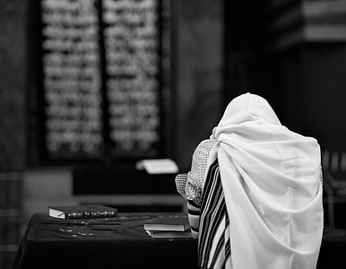 grayscale photo of books on table thumbnail