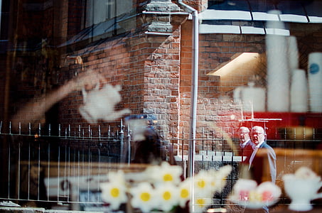 man looking through glass window thumbnail