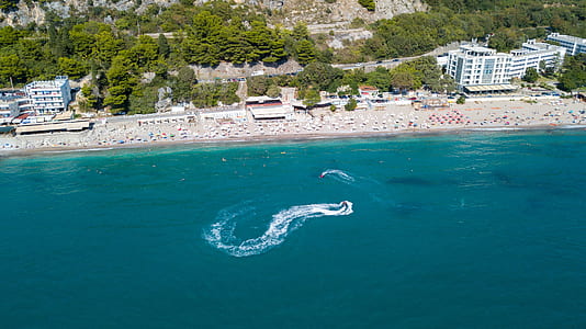 aerial photography of building near sea at daytime thumbnail