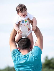 man carrying child thumbnail