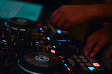 person holding DJ controller thumbnail