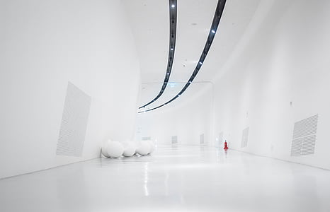 person taking photo of hallway thumbnail