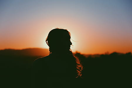 silhouette of woman during golden hour thumbnail