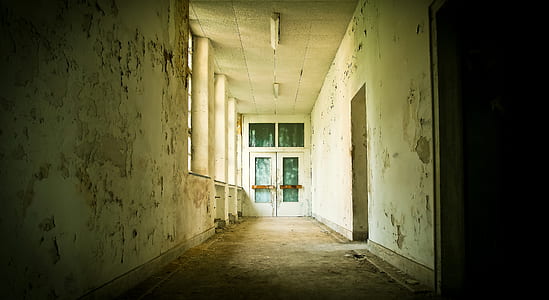 white concrete hallway during daytime thumbnail