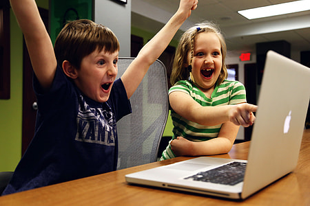 Kids excited at a laptop thumbnail