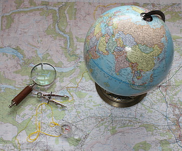 magnifying mirror beside desk globe thumbnail