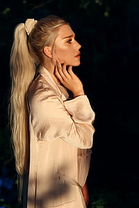 woman wearing white long-sleeved top thumbnail