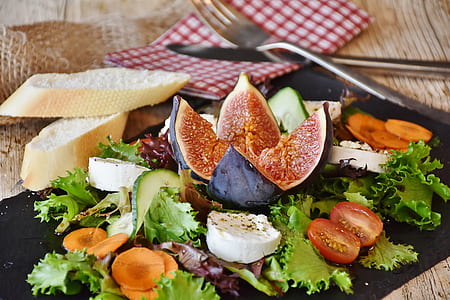vegetable dish on black mat with toast thumbnail