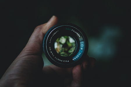 person holding Fujifilm lens thumbnail