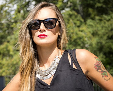 woman facing at the camera during daytime thumbnail