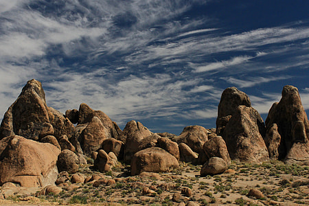 brown rock formation under blue sky at daytime thumbnail