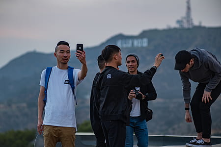 people taking photo on mountains thumbnail