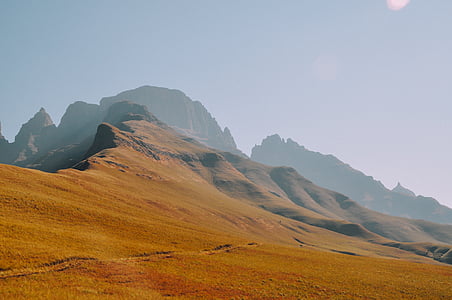 brown mountain range under clear day sky thumbnail