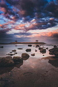 Island under cumulus clouds thumbnail