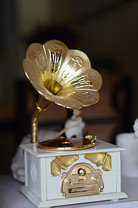 brass-colored and white gramophone thumbnail