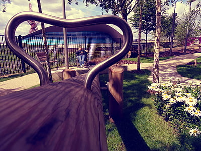 person sitting on chair near fence thumbnail