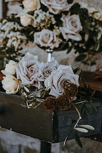 white rose flowers on top of black table thumbnail