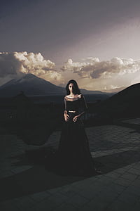 woman wearing black sleeveless dress thumbnail