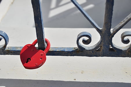 red heart padlock on black metal rail thumbnail