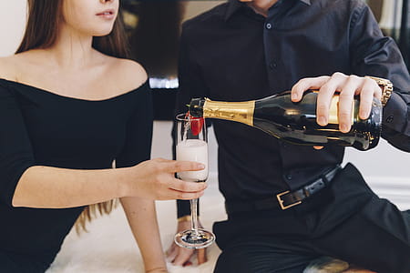 Couple Pouring Champagne Photo thumbnail