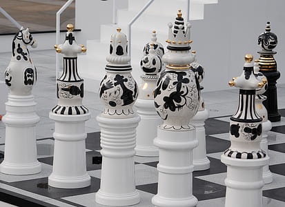white chess pieces on board thumbnail