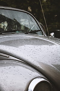 gray Volkswagen Beetle with water dew at daytime thumbnail