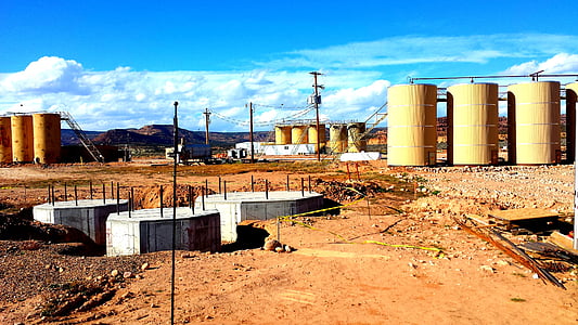 oil tanks on brown land thumbnail