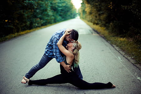 man and woman making stunt on road thumbnail