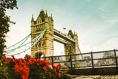 tower bridge under cloudy sky thumbnail