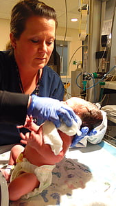 woman carrying baby thumbnail