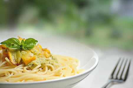 closeup photo of pasta on bowl beside fork thumbnail