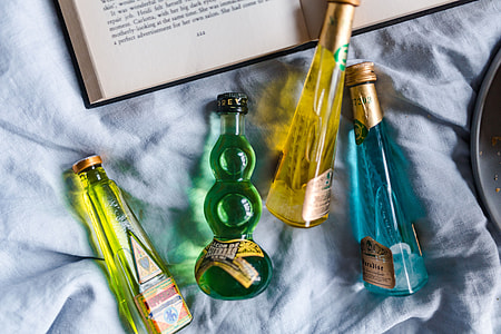 Group of colorful little bottles with liqueurs thumbnail