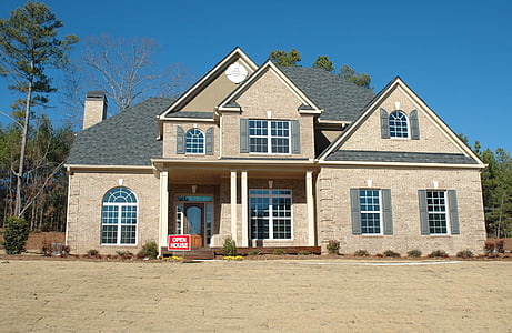 white and gray concrete house under blue sky thumbnail