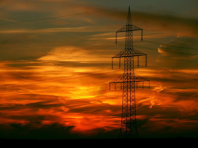 gray transmission post under orange sky thumbnail