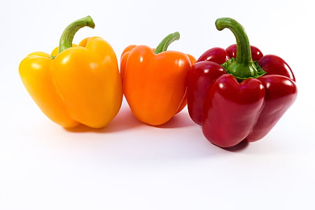 three red, orange, and yellow bell peppers on white surface thumbnail
