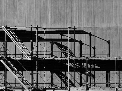 gray steel ladder on wall thumbnail