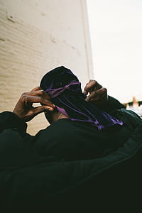 person wearing black crew-neck shirt thumbnail