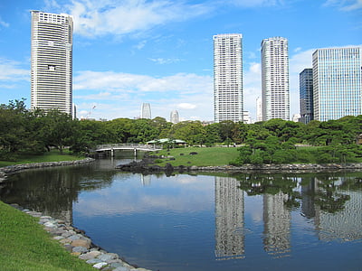 concrete buildings near river thumbnail