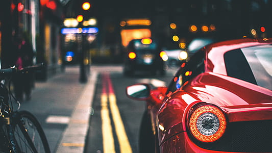 selective focus photo of red car thumbnail
